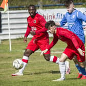 Hawick Royal Albert's Greg Ford on the ball against Golspie Sutherland in 2021, supported by Joe Ngoa (Pic: Bill McBurnie)
