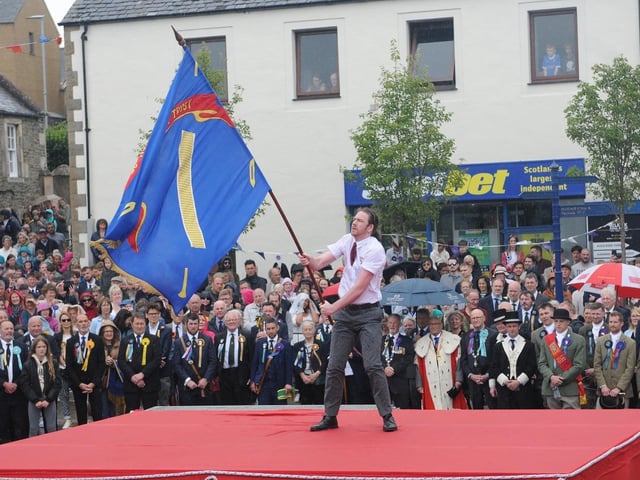 Weavers standard bearer Stu Harkness.
