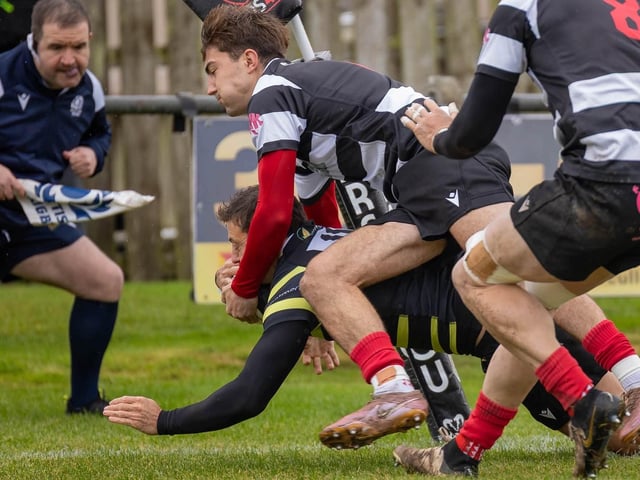Archie Barbour making a challenge for Kelso, on Donald Crawford, as they beat Melrose 39-22 at home at Poynder Park on Saturday (Photo: Andy McLean)