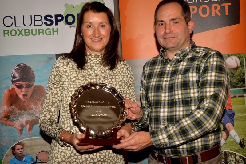 Hawick bowler Julie Forrest being given a special achievement accolade at ClubSport Roxburgh's 2023 award night in Kelso on Friday by Live Borders club and community development officer Chris Bryant