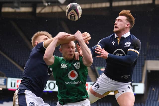 Keith Earls competes for the ball with Scotland's Chris Harris and Stuart Hogg ahead of Ireland's first try at Murrayfield Stadium in Edinburgh (Photo by Stu Forster/Getty Images)