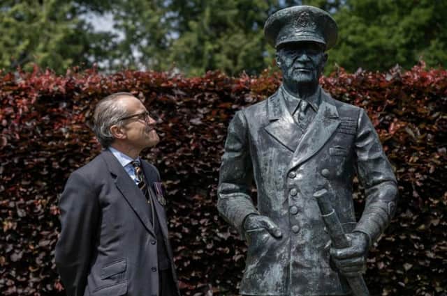 William Ramsay with the statue of his grandfather, Admiral Sir Bertram Ramsay in the grounds of Bughtrig House. Photo: Phil Wilkinson.