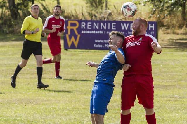 Lewis Turnbull, left, putting in an aerial challenge for Ancrum against Coldstream Amateurs (Photo: Bill McBurnie)
