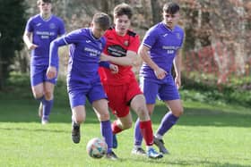 David Brown, centre, challenging for possession during Earlston Rhymers' 3-0 win at home to Hawick Waverley on Saturday in the Border Amateur Football Association's A division (Photo: Brian Sutherland)