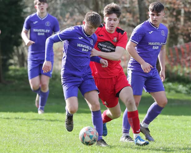 David Brown, centre, challenging for possession during Earlston Rhymers' 3-0 win at home to Hawick Waverley on Saturday in the Border Amateur Football Association's A division (Photo: Brian Sutherland)