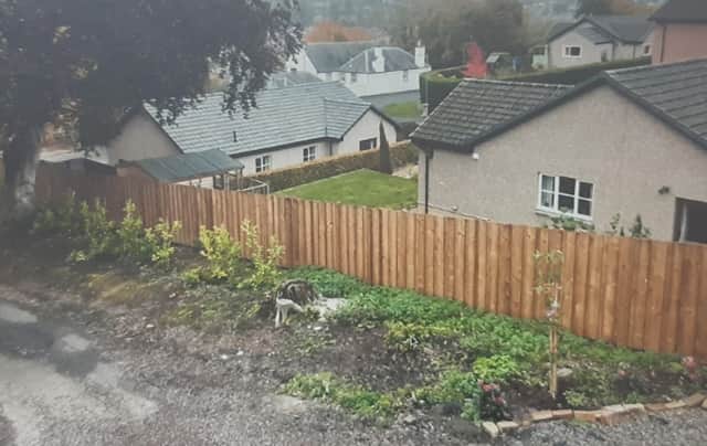The neighbour says the fence would be better suited to an industrial estate.