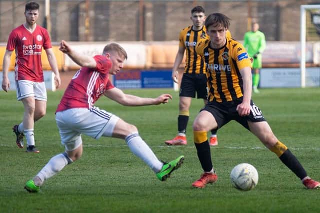 Gala Fairydean Rovers defender Calum Hall attempting to get a block in against Berwick Rangers (Photo: Alan Bell)