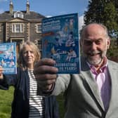 Festival directors Paula Ogilvie and Alistair Moffat at Harmony House with the programme for this year's four-day spectacular. Photo: Johnston Montgomery.