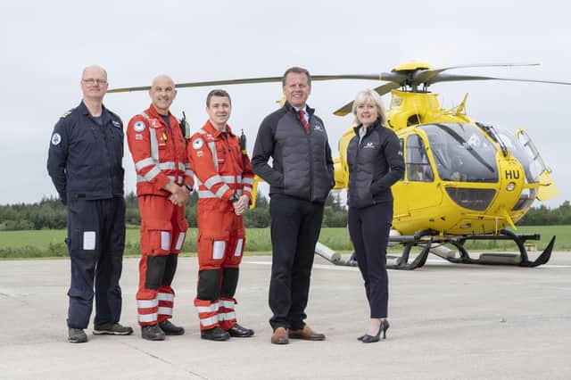 Captain Russell Myles (Pilot), John Pritchard (Lead Paramedic) and Ali Daw (Paramedic) from SCAA, alongside Stephen and Fiona Leckie from Crieff Family of Hotels.