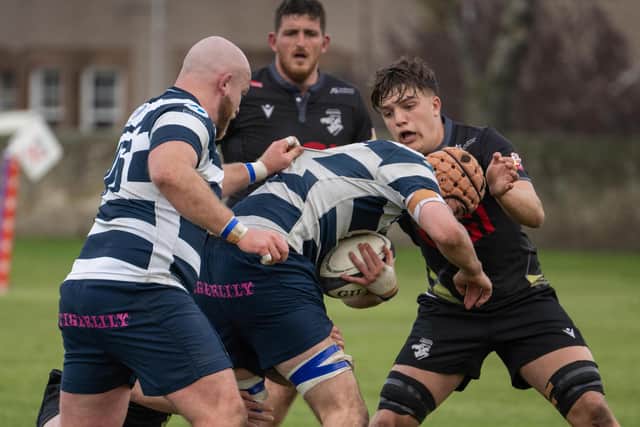 Sam Derrick getting a tackle in for Southern Knights versus Heriot's (Pic: Jonathan Cruickshank)