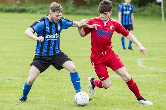 Kelso Thistle's Brad Adams and Biggar United's Tom Robertson challenging for the ball on Friday (Photo: Bill McBurnie)