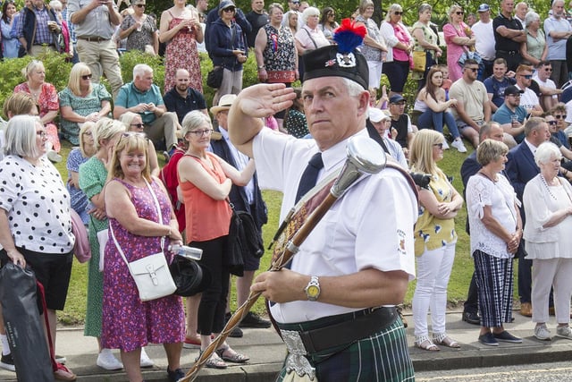 Jedburgh Royal British Legion Pipe Band's Brian Scott salutes at the War Memorial during the festival day proceedings