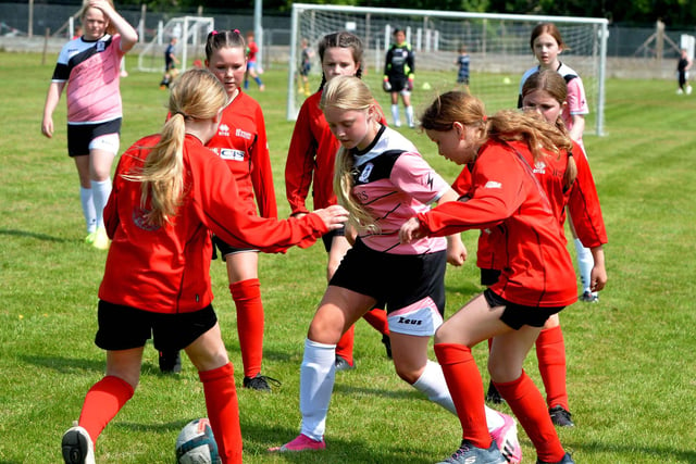 Girls from Hawick and Langholm taking part in Sunday's children's football festival at Netherdale in Galashiels