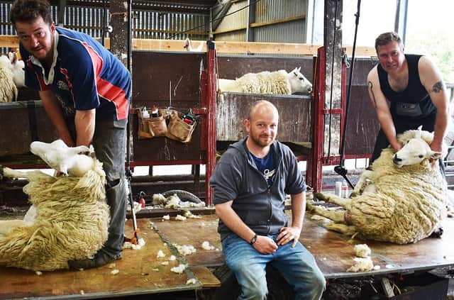 Brothers Callum and Duncan Hume pictured with Jason Bain (right) during his visit to Sundhope Farm. Photo: John Smail.