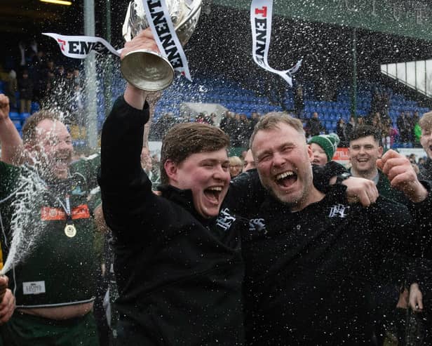 Hawick head coach Matty Douglas and backs coach Graham Hogg, right, celebrating after winning last March's Scottish Premiership play-off final against Currie Chieftains at home at Mansfield Park (Photo by Mark Scates/SNS Group/SRU)