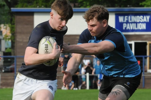Blake Cullen on the attack for the hosts during their 43-0 last-eight win against Berwick at Saturday's Selkirk Sevens (Photo: Grant Kinghorn)