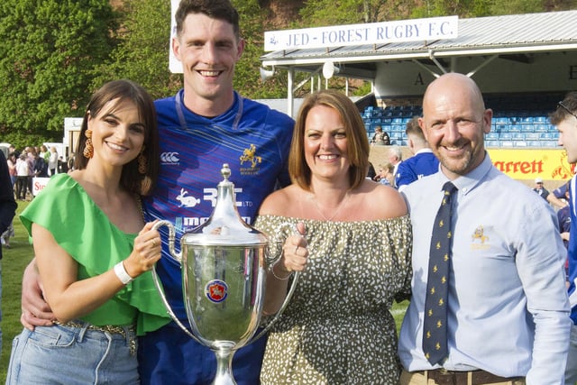 Jed-Forest captain Gregor Young and partner Emily holding the Kings of the 7s trophy with outgoing club president Paul Cranston and wife Anne
