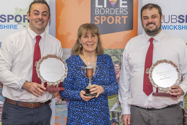 Eyemouth United Amateurs' Lee and John Crawford being given their joint award for coach of the year by prize sponsor Moira Anderson
