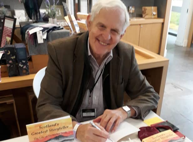 Alasdair Hutton signs copies of his book at Abbotsford.