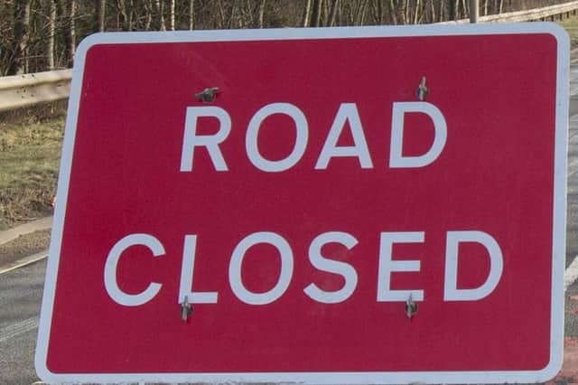 Road closed between Galashiels and Selkirk due to an overturned lorry.