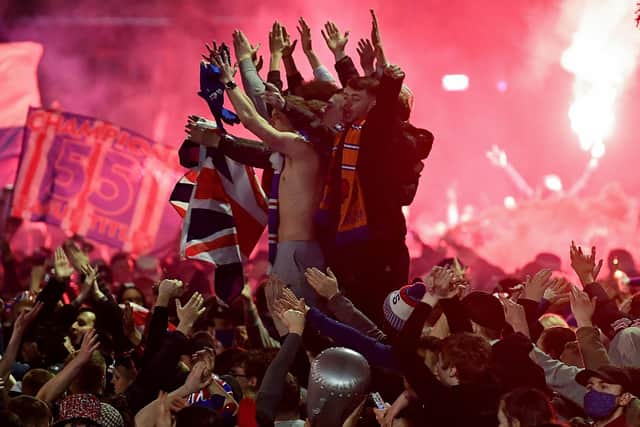 Rangers fans gather in Glasgow's George Square to celebrate the club winning the Scottish Premiership for the first time in 10 years on March 7 (Photo by Jeff J Mitchell/Getty Images)