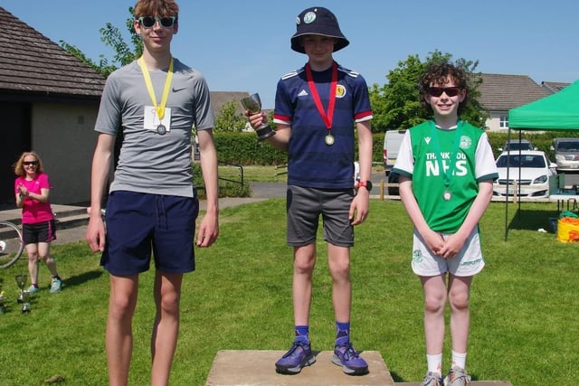 Archie Dalgliesh, winner of St Boswells village race's class for boys aged 12 to 15, with runner-up Charlie Dalgliesh and third-placed Edward Green