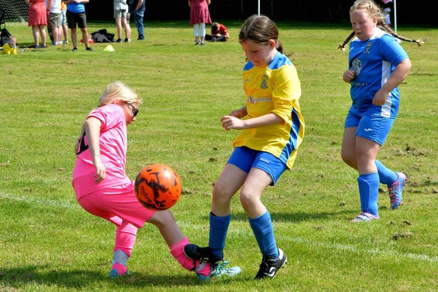 Girls from Innerleithen and Coldstream in action at Sunday's children's football festival at Galashiels
