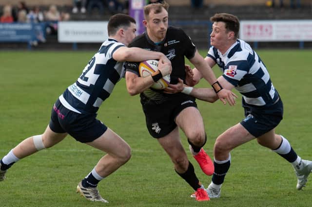 Southern Knights' Nathan Chamberlain being tackled by Heriot's Bruce Houston at Goldenacre in Edinburgh on Saturday (Photo by Mark Scates/SNS Group/SRU)
