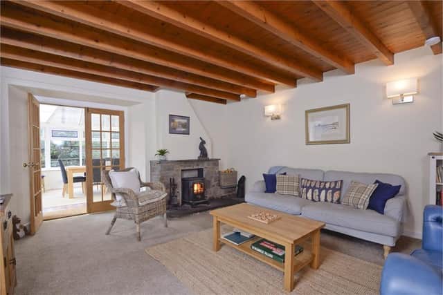 The cottage retains many traditional features such as timber ceiling beams.