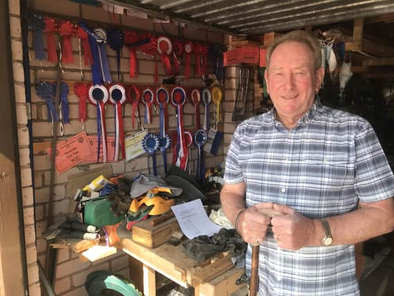Stick maker Iain Paterson's garage is bedecked in winner's rosettes.