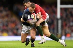 Hawick's Stuart Hogg being tackled by Wales centre Owen Watkin during Scotland's Six Nations match in Cardiff on Saturday (Photo by Clive Mason/Getty Images)