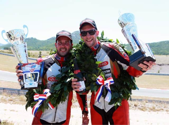 Lauder sidecar racer Steve Kershaw, right, and passenger Ryan Charlwood celebrating their first win of the season in Croatia on Sunday (Photo: Mark Walters)