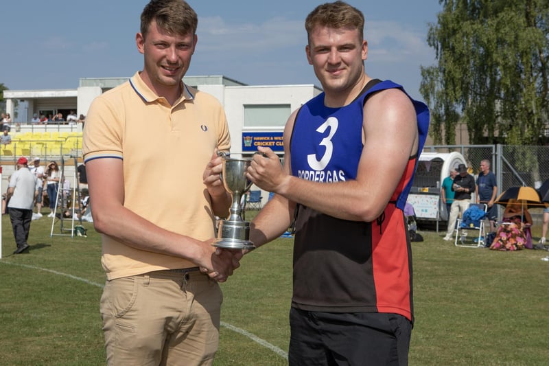 Hawick's Ronan McKean being presented with his prize for winning the 100m invitational race at Sunday's Hawick Border Games in 11.49 seconds, from an 8m mark