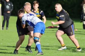 Liam Graham on the ball for Hawick Harlequins, with Damian Wargacki challenging, as they beat Hawick Linden 19-17 at home at Wilton Lodge Park on Saturday (Photo: Sel Messer)