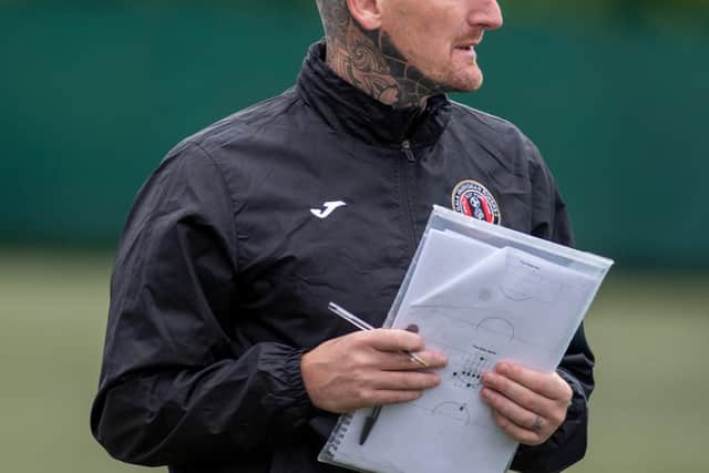 Gala Fairydean Rovers boss Martin Scott with his tactical notes