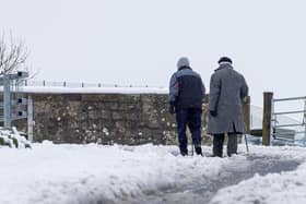Pedestrians tackle the snow in Stow last month. More is expected across the Borders over the weekend.