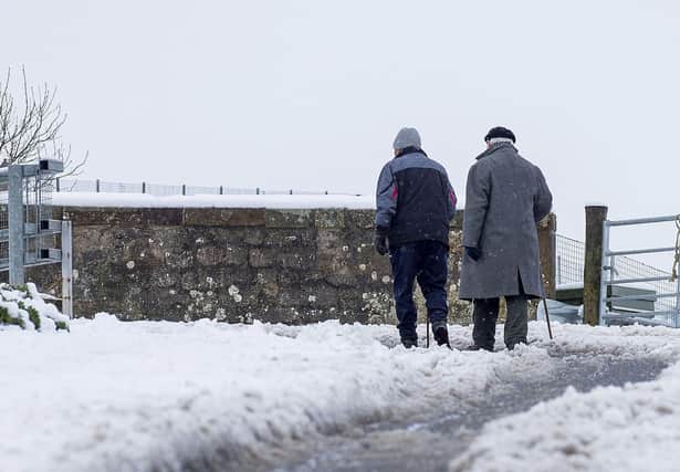 Pedestrians tackle the snow in Stow last month. More is expected across the Borders over the weekend.