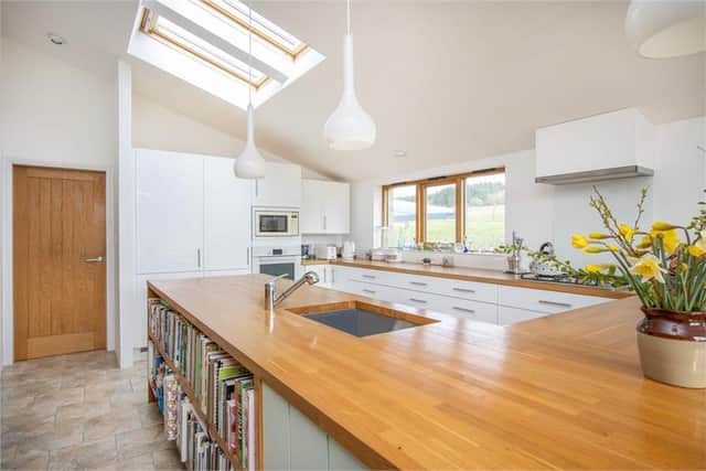 The property has a bright open-plan kitchen.
