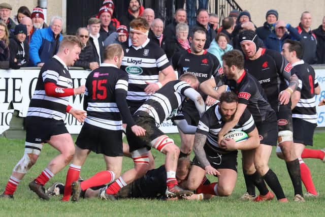 Kelso's Bruce McNeil being stopped in his tracks by Biggar at Hartreemill (Photo: Nigel Pacey)