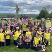 Chirnside Brownies commemorate the Kings Coronation by planting a tree.