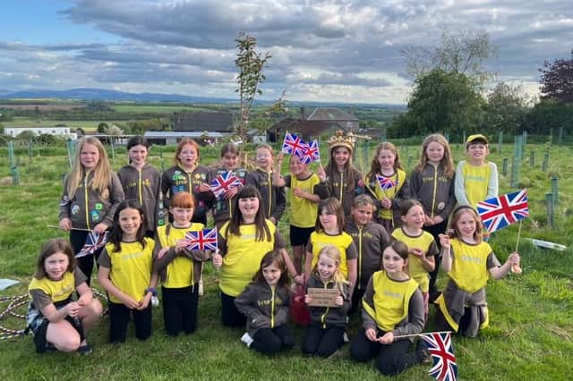 Chirnside Brownies commemorate the Kings Coronation by planting a tree.