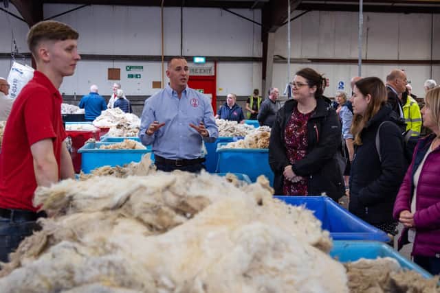 Michael Sanderson, depot manager at the British Wool Borders depot, explains wool grading to visitors.
