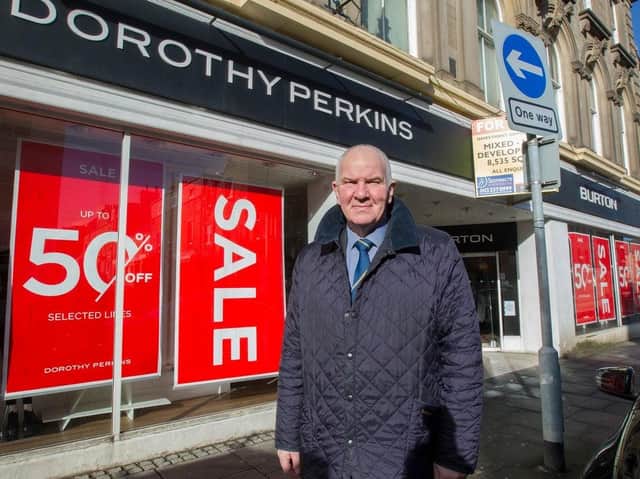 Councillor Watson McAteer beside the former Burtons and Dorothy Perkins stores.  (Photo:BILL McBURNIE)