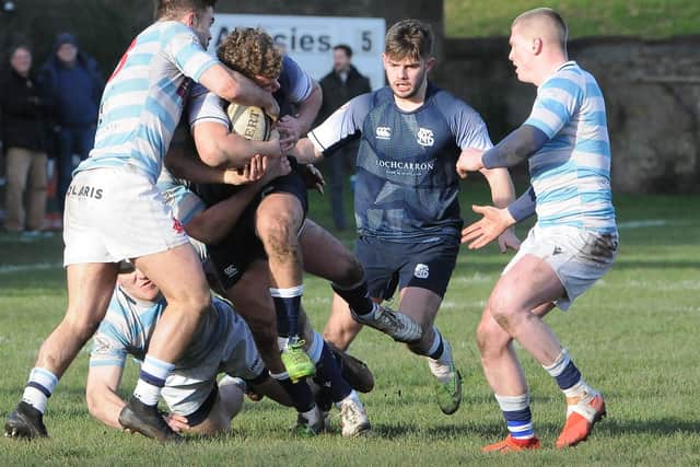 Callum Anderson, with Finlay Wheelans in support, being halted during Selkirk's 31-29 win away to Edinburgh Academical at Raeburn Place on Saturday (Photo: Grant Kinghorn)