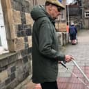 David Murray, out walking in Galashiels with his long cane.
