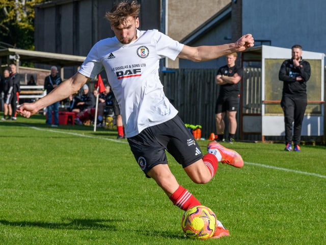 Kieran Burns in action for Duns Amateurs as they beat Hawick United 9-1 at home in round one of this football season’s Waddell Cup on Saturday (Photo: Alan Raeburn)