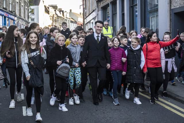 2022 Hawick Cornet Greig Middlemass leads the Cornet's Walk around the town following his election as Cornet. Photo: Bill McBurnie