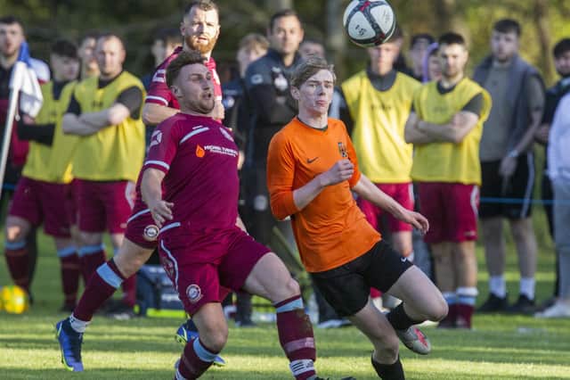 Hawick United's Dylan Ellins challenging for the ball against Eyemouth United Amateurs during last Friday's Forsyth Cup final in Earlston (Photo: Bill McBurnie)