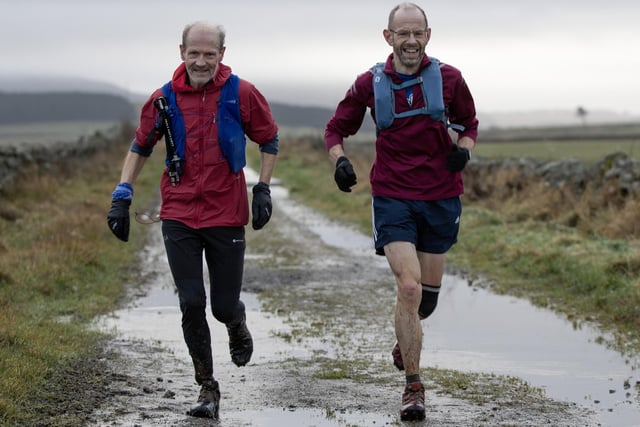 Two men taking part in Lauderdale Limpers and Gala Harriers' social run from Tweedbank to Lauder on Tuesday