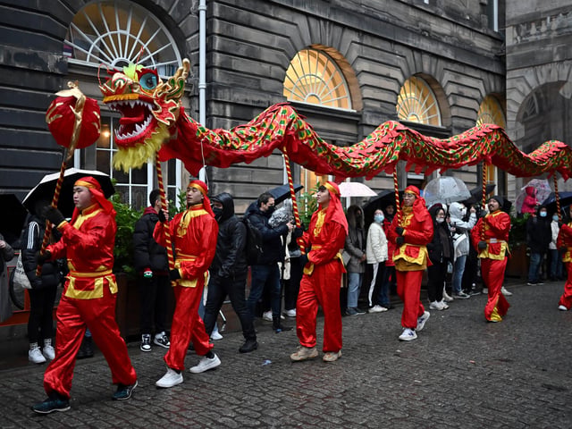 The parade wove through the streets of Edinburgh before making its way to Edinburgh Castle for an impressive light display.